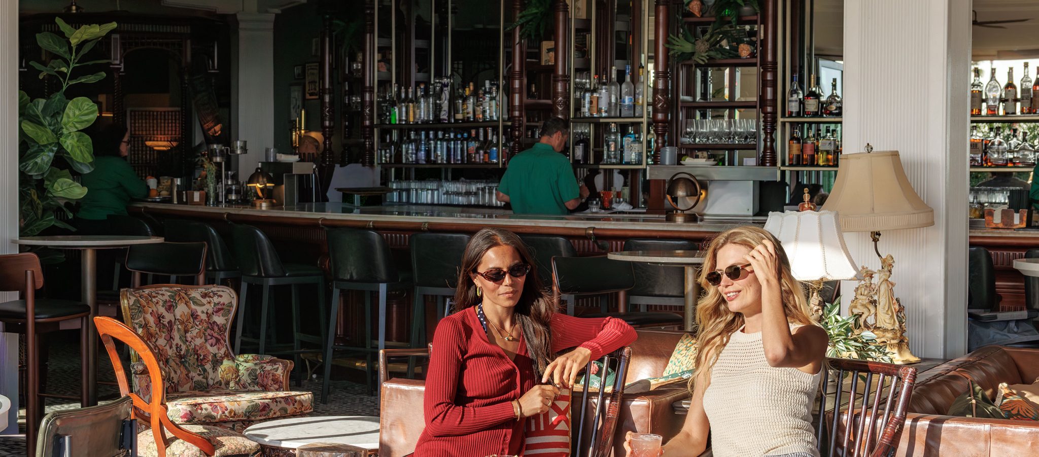 Ladies at the bar with food and drinks
