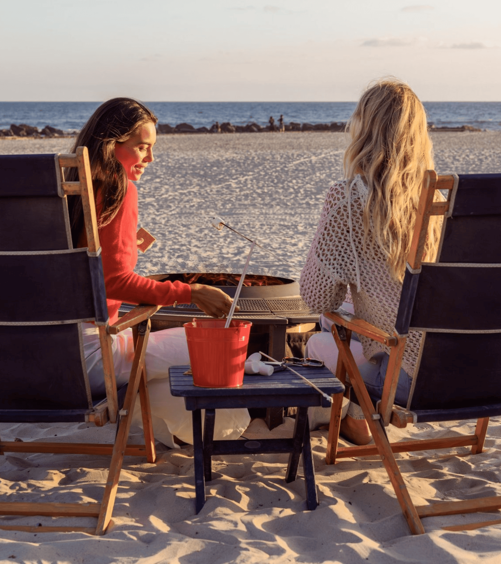 two girls roasting s'mores