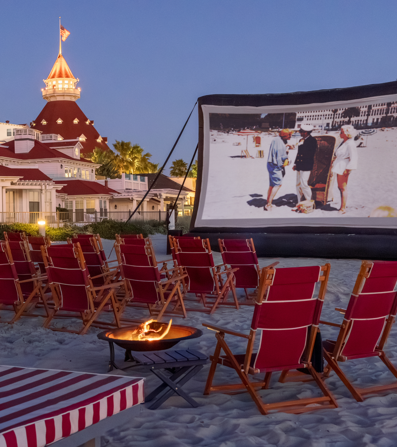 movies on the beach with chairs and bonfire