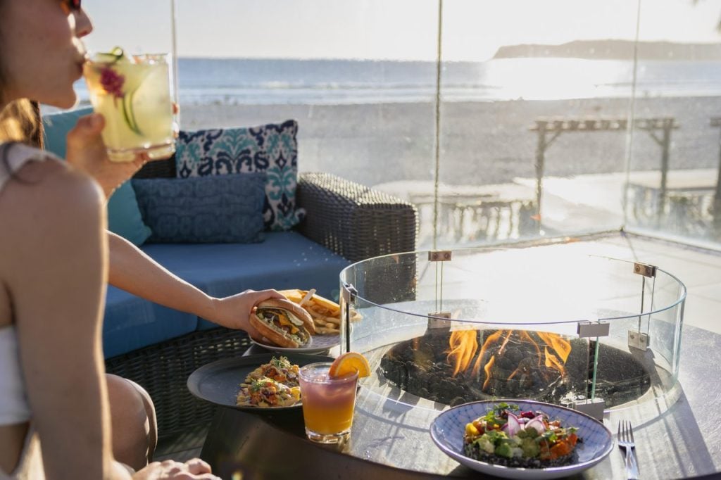 Food and drinks by a fire pit