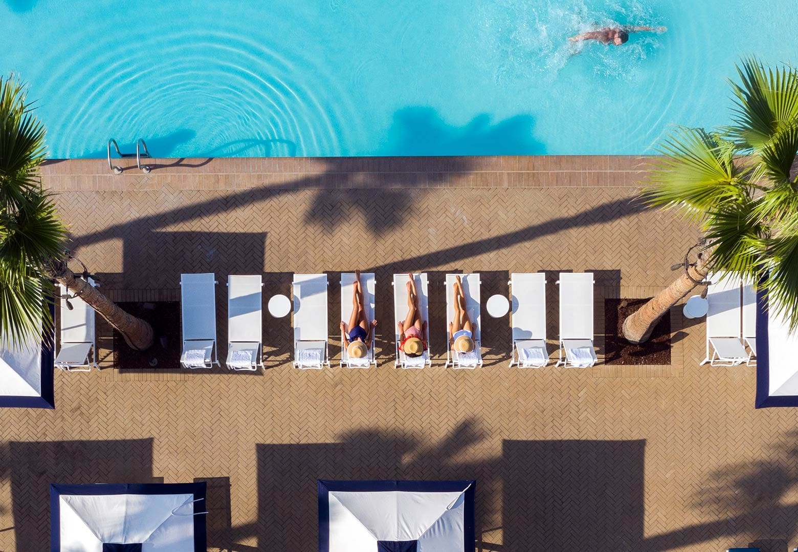 Ladies lounging at pool