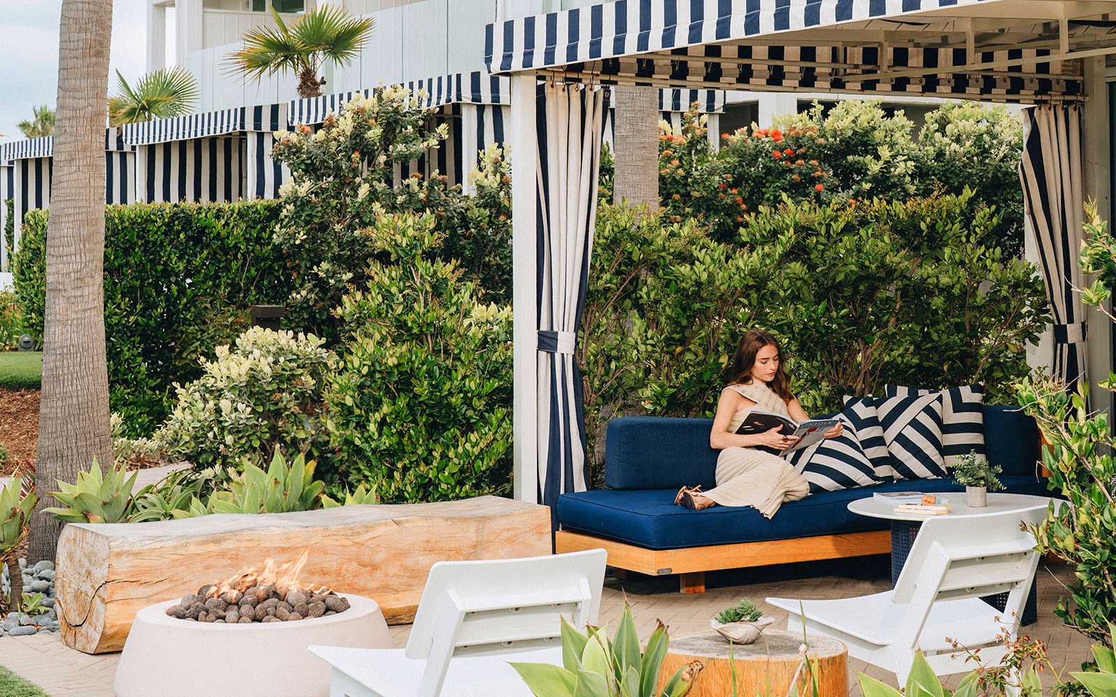 Woman reading on a guest room terrace