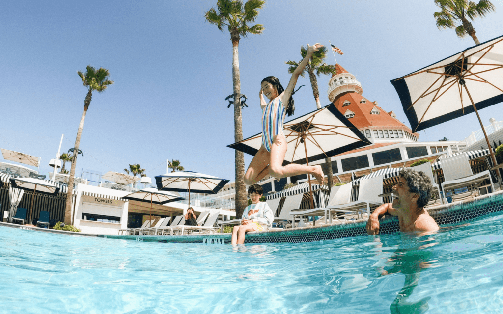 girl jumping in pool
