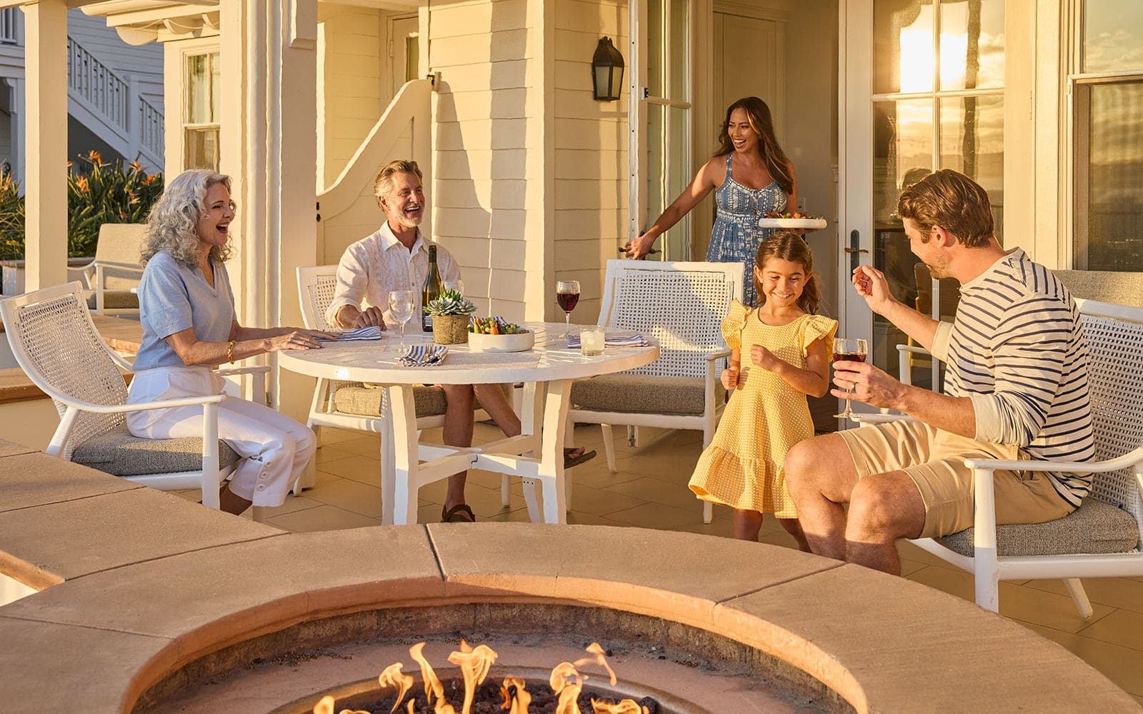 Family on Beach Village Cottage patio