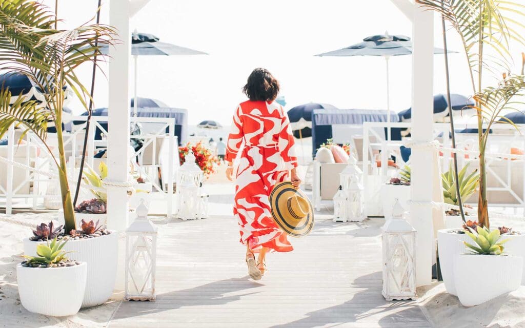 Woman walking into The Beach Club