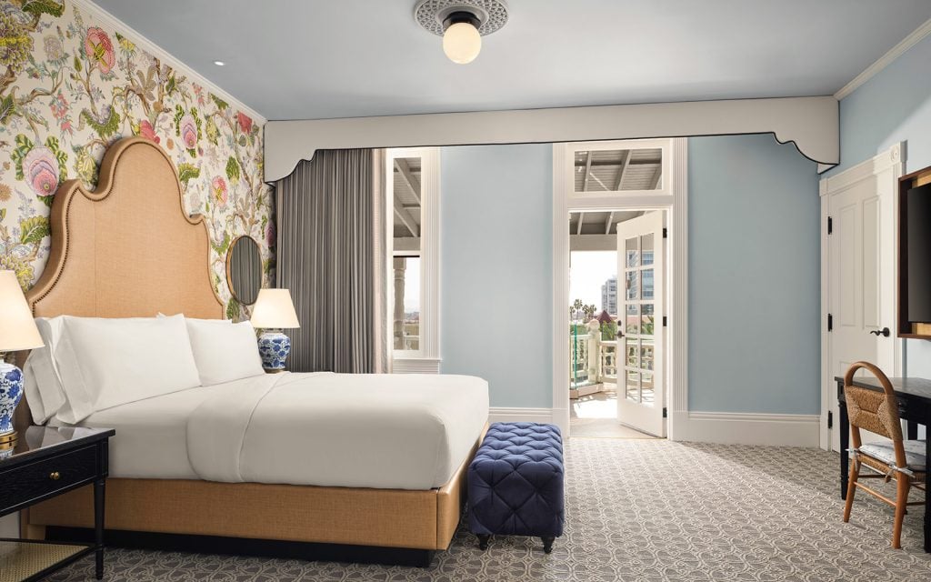 Resort view Victorian guest room with king bed and balcony