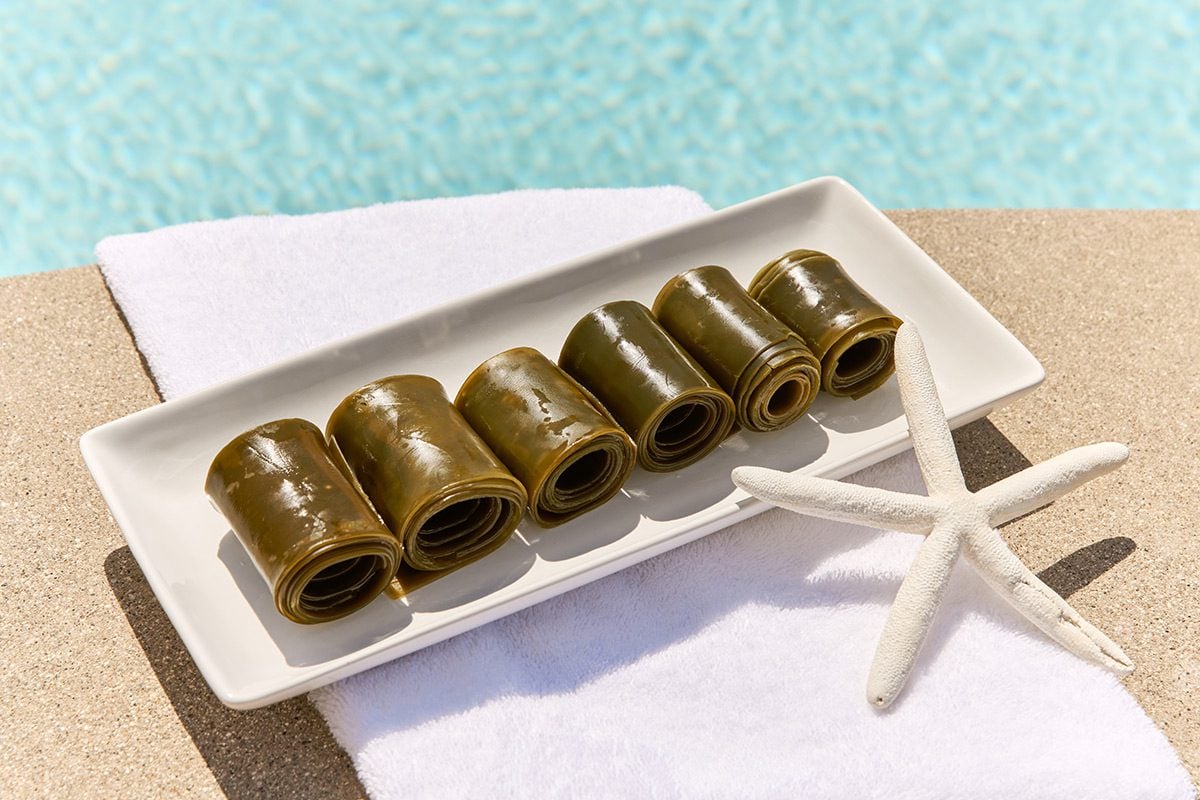 seaweed wraps sitting next to the pool on a towel