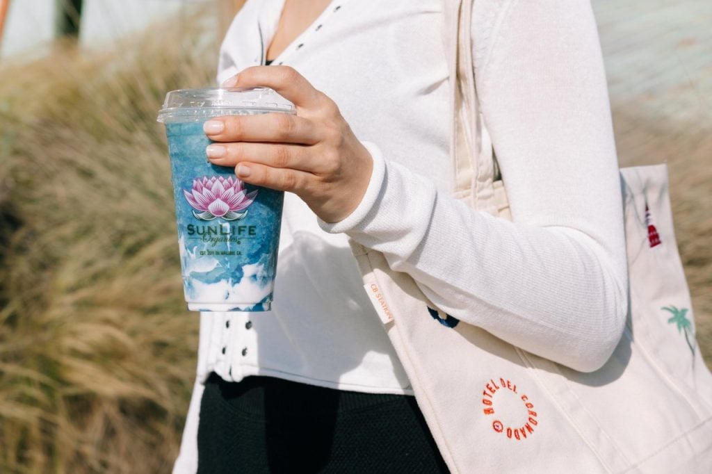 Hand holding blue smoothie