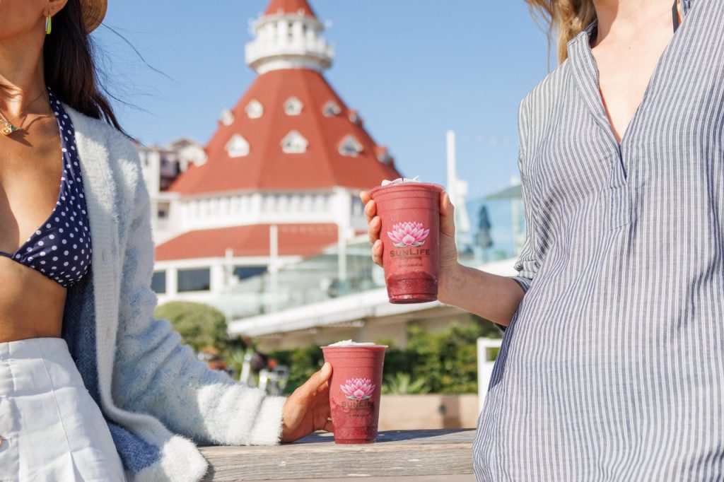 Ladies holding two smoothies