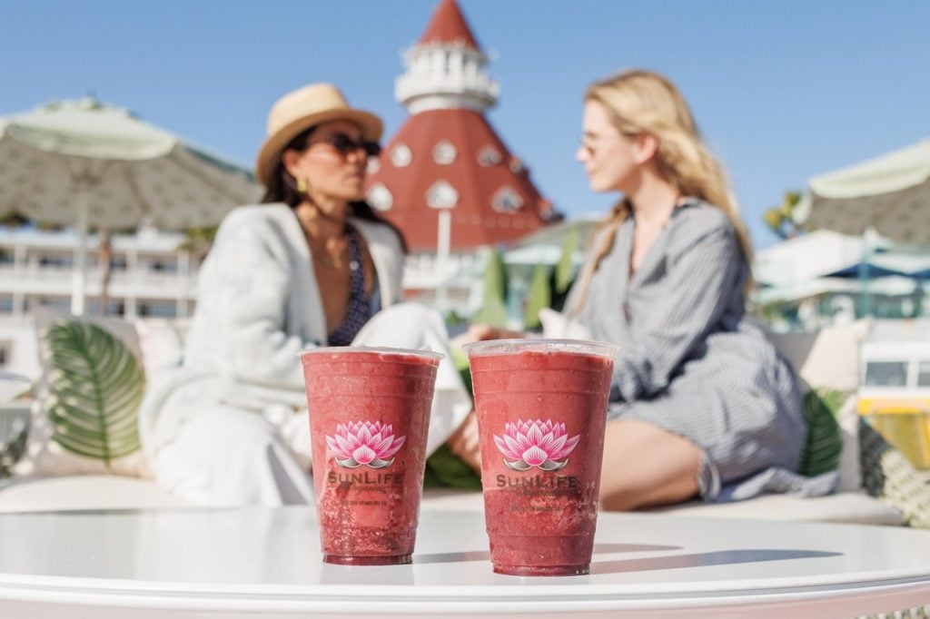 Two smoothies with ladies sitting behind