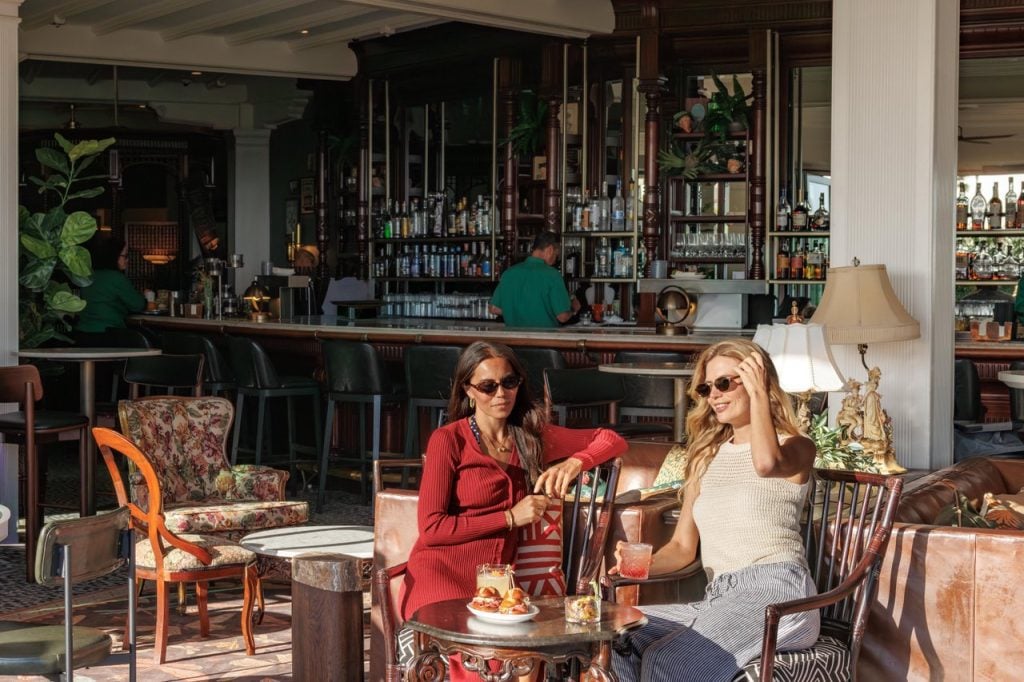 Ladies at the bar with food and drinks